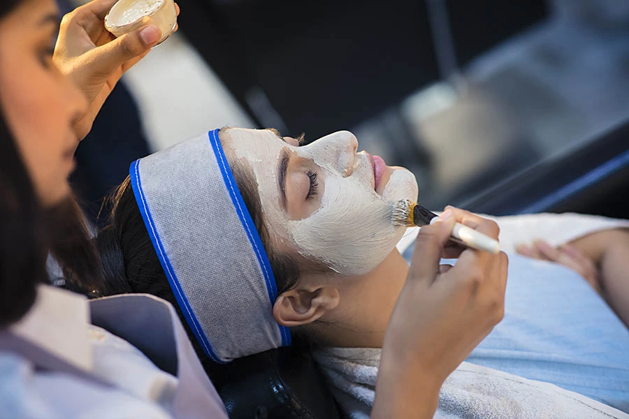 a woman is having fire and ice facial in pune